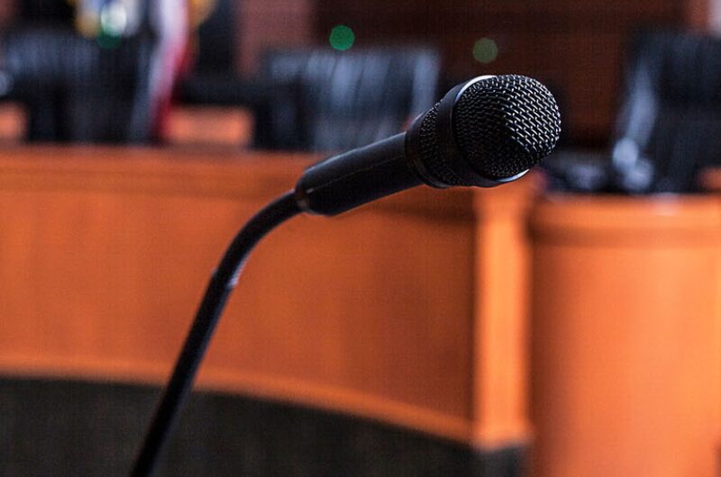 Legislative committee hearing podium microphone.